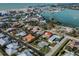 Aerial view of a house with a pool and a large backyard, located near the water at 900 Osprey St, Venice, FL 34285