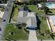 An aerial shot of a house with a pool and a large backyard at 900 Osprey St, Venice, FL 34285