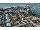 Aerial view showcasing a single-Gathering home's location in a residential neighborhood near the coast at 900 Osprey St, Venice, FL 34285
