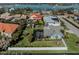 Aerial view of house, pool, and backyard near the water at 900 Osprey St, Venice, FL 34285