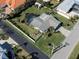 Aerial view of a house with a pool and a large backyard at 900 Osprey St, Venice, FL 34285