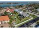 Aerial view of a home with a pool and lush landscaping at 900 Osprey St, Venice, FL 34285