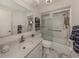 Clean bathroom with a shower/tub combo, vanity, and updated fixtures at 900 Osprey St, Venice, FL 34285