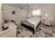 Bedroom with a queen bed, nightstands, and tiled floor at 900 Osprey St, Venice, FL 34285