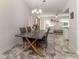 Dining area with grey chairs and a modern table at 900 Osprey St, Venice, FL 34285