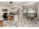Open concept kitchen with granite countertops and white cabinetry at 900 Osprey St, Venice, FL 34285