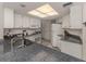 Clean and bright kitchen with white cabinets and granite countertops at 900 Osprey St, Venice, FL 34285