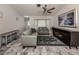 Spacious living room with light grey sofas and a large TV at 900 Osprey St, Venice, FL 34285