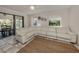 Relaxing living room with large sectional sofa and sliding doors to patio at 900 Osprey St, Venice, FL 34285