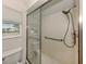 Walk-in shower with grab bars and a window at 900 Osprey St, Venice, FL 34285