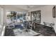 Sunroom with a table, chairs, and view of the pool at 900 Osprey St, Venice, FL 34285
