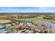 Community overview featuring clubhouse, pool, and tennis courts at 10058 Crooked Creek Dr # 201, Venice, FL 34293