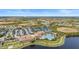 Community features resort-style pool, tennis courts, and parking at 10058 Crooked Creek Dr # 201, Venice, FL 34293