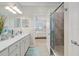 Spa-like bathroom with double vanity and walk-in shower at 10058 Crooked Creek Dr # 201, Venice, FL 34293