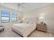 Spacious bedroom with king-size bed and neutral decor at 10058 Crooked Creek Dr # 201, Venice, FL 34293