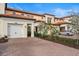 Townhouse with attached garage and landscaped front yard at 10058 Crooked Creek Dr # 201, Venice, FL 34293