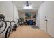 Garage with room for bikes, storage shelving, and extra items at 10058 Crooked Creek Dr # 201, Venice, FL 34293