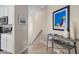 Stair landing with a console table and artwork at 10058 Crooked Creek Dr # 201, Venice, FL 34293