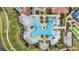 Overhead view of a large resort-style pool with surrounding lounge chairs at 10058 Crooked Creek Dr # 201, Venice, FL 34293