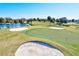 Golf course view showing green and sand traps at 1008 Burning Oak Ct, Venice, FL 34293