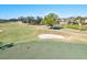 Golf course green with sand trap and flag at 1008 Burning Oak Ct, Venice, FL 34293