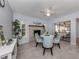 Bright dining area with fireplace and view to backyard at 1041 Citrus Rd, Venice, FL 34293