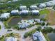 Aerial view of community with pool and landscaping at 10501 Amberjack Way # 103, Englewood, FL 34224