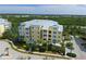 Aerial view of building and waterfront property at 10501 Amberjack Way # 103, Englewood, FL 34224