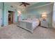 Main bedroom with ensuite bathroom access and a private balcony at 10501 Amberjack Way # 103, Englewood, FL 34224