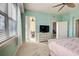 Bedroom with balcony access and built-in dresser at 10501 Amberjack Way # 103, Englewood, FL 34224