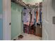 Well-organized walk-in closet with shelving and hanging rods at 10501 Amberjack Way # 103, Englewood, FL 34224