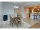 Charming dining area with kitchen and entryway views at 10501 Amberjack Way # 103, Englewood, FL 34224