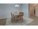 Cozy dining area featuring a rustic table and chairs at 10501 Amberjack Way # 103, Englewood, FL 34224