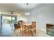 Bright dining area with rustic table and chairs, offering a casual and comfortable space at 10501 Amberjack Way # 103, Englewood, FL 34224