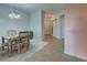 Light and airy entryway with view to dining area and kitchen at 10501 Amberjack Way # 103, Englewood, FL 34224