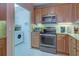 Convenient laundry room with washer and dryer in the kitchen area at 10501 Amberjack Way # 103, Englewood, FL 34224