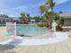 Community pool with a separate shallow area for children at 10501 Amberjack Way # 103, Englewood, FL 34224