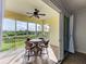 This screened balcony offers scenic views and access from the living room at 10501 Amberjack Way # 103, Englewood, FL 34224