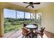 Enjoy peaceful water views from this screened in balcony with seating at 10501 Amberjack Way # 103, Englewood, FL 34224