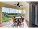 Spacious screened balcony with water views and patio furniture at 10501 Amberjack Way # 103, Englewood, FL 34224