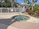 Relaxing community spa surrounded by lush landscaping at 10501 Amberjack Way # 103, Englewood, FL 34224
