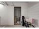 Private storage unit with mesh door and shelving at 10501 Amberjack Way # 103, Englewood, FL 34224