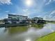 Waterfront view of building and landscaping at 10501 Amberjack Way # 103, Englewood, FL 34224