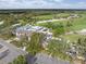 Aerial view of community clubhouse near golf course at 10984 Trevino St, Englewood, FL 34223