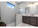 Spa-like bathroom featuring a walk-in shower and modern fixtures at 10984 Trevino St, Englewood, FL 34223