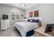 Spacious bedroom with king-size bed, dresser, and large window at 10984 Trevino St, Englewood, FL 34223