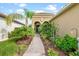 Inviting home exterior with landscaped walkway and entryway at 10984 Trevino St, Englewood, FL 34223