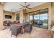 Outdoor dining area with table, chairs, and ceiling fan at 10984 Trevino St, Englewood, FL 34223