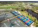 Aerial view of community pickleball and tennis courts at 10984 Trevino St, Englewood, FL 34223