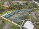 Aerial view of community tennis and pickleball courts at 10984 Trevino St, Englewood, FL 34223